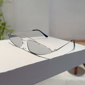 Detail of silver double bridge metal frame sunglasses with triangle lenses and nose pads