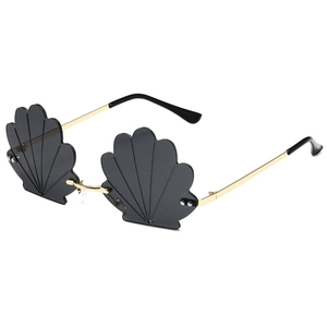 Unique shell-shaped rimless sunglasses with dark lenses and gold metal temples for party