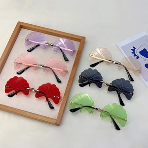 Frameless ginkgo leaf sunglasses in multiple colors with gold metal bridge and sleek temples