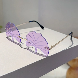 Close-up of rimless ginkgo leaf sunglasses with purple lenses and gold metal temples