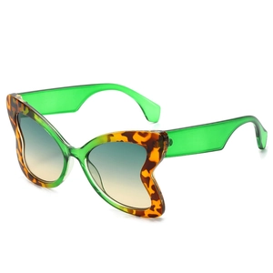 Butterfly frame sunglasses with green translucent finish and leopard pattern accents