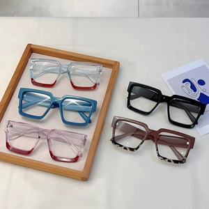 Modern square blue light glasses in five color varieties including red and tortoiseshell