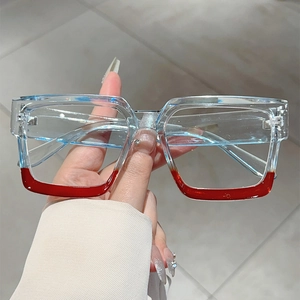 Fashionable oversized square glasses in transparent blue and red color-block design