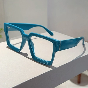 Detail of blue rectangular thick-frame glasses with wide temples and metal hinge craftsmanship