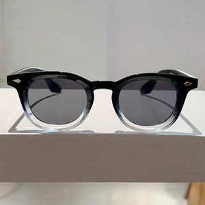 Front view of retro round sunglasses with gradient frame and metallic rivet detailing