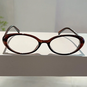 Detail of vintage oval tortoiseshell eyeglass frames with sturdy metal hinges