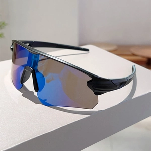 Detail showing sleek black half-frame sports sunglasses with blue mirrored coating lens