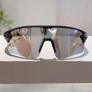 Detail of professional sports sunglasses with silver mirrored lenses and matte black frame