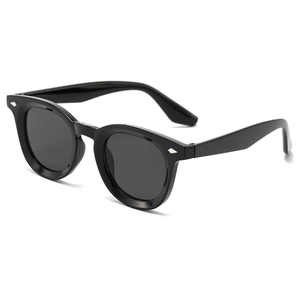 Classic retro round frame sunglasses in black with silver diamond rivets and dark lenses