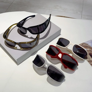Y2K futuristic wrap-around and rectangular sunglasses in black, green, and red