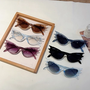 Set of six colorful bat-wing shaped sunglasses in hip-hop and avant-garde styles
