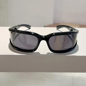 Detail view of black wrap-around Y2K sunglasses with streamlined aerodynamic frames