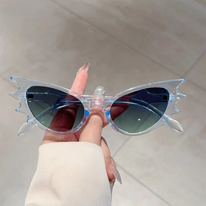 Edgy bat wing flame shaped oversized sunglasses with transparent blue resin frames