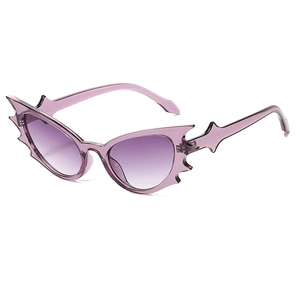 Futuristic purple bat wing sunglasses with cat eye gradient lenses for parties