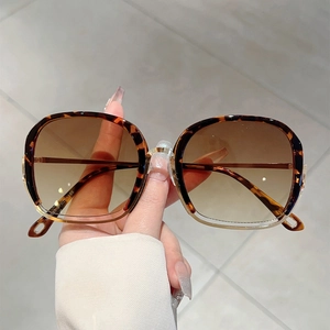 Square tortoise shell sunglasses with gradient brown lenses and gold metal accents