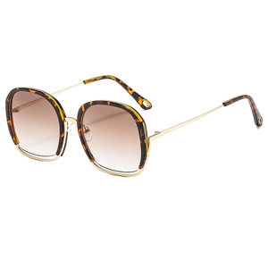 Square tortoiseshell sunglasses with gold metal frame and brown gradient lenses