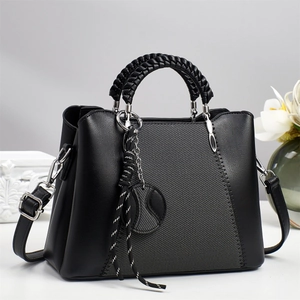 Women's black leather and grey fabric crossbody tote bag with V-stitch details