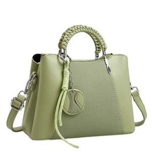 Green minimalist crossbody handbag with textured weaving and woven top handle for women