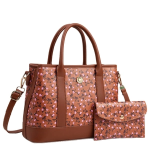 Brown leather tote bag and pouch set with pink cherry prints and gold sunflower buckle