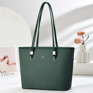 Dark green large capacity leather tote bag with woven texture and gold hardware details