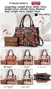 Detail view of cherry print tote bag and coin purse with 29x13x22cm dimensions