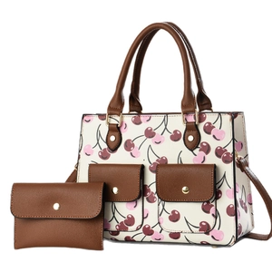 Chic white cherry print tote bag and matching wallet set with brown leather handles
