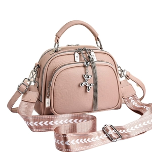 Pink lychee texture shoulder bag for women with silver balloon dog and fringe charm