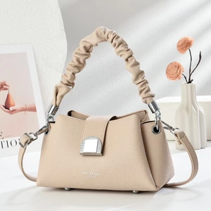 Elegant apricot lychee leather crossbody bag with pleated cloud handle and silver buckle