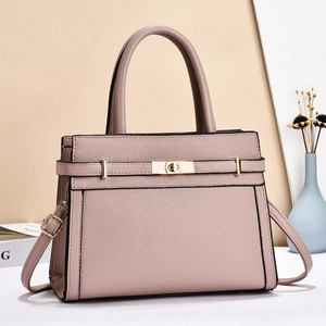 Elegant mauve lychee grain leather handbag with gold twist lock and adjustable strap