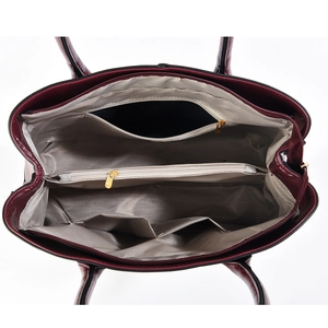 Spacious interior of the faux-croc leather handbag with herringbone lining and multiple pockets