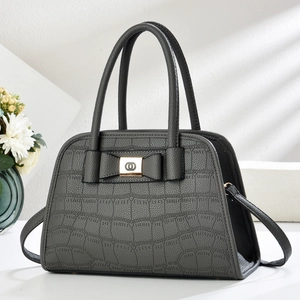 Elegant dark grey crocodile pattern handbag with golden bow buckle and slim shoulder strap