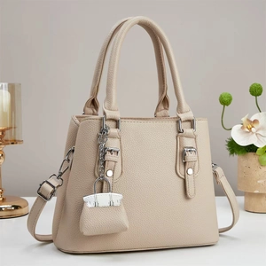 Elegant beige lychee texture leather tote bag with top handles and adjustable strap