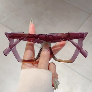 Detail of translucent purple geometric eyeglass frames with durable metal hinges