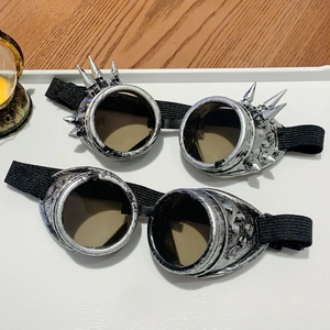 Macro detail of vintage punk steampunk goggles with rivets and ornate metal carvings