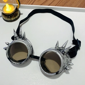 Detail of silver steampunk goggles with metallic spikes and retro industrial design