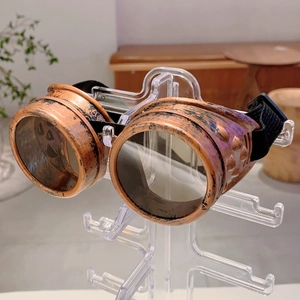 Macro detail of bronze steampunk goggles with vintage metal finish and side rivet studs