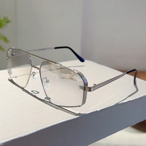 Detail of silver irregular polygon sunglasses with double bridge and textured metal frames
