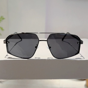 Detailed silver mesh texture on metal hinge of black pilot sunglasses with double bridge