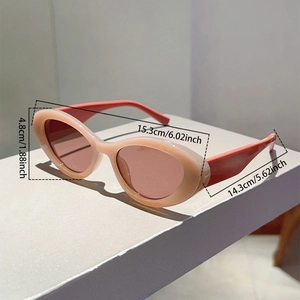 Detailed view of oval cat-eye sunglasses dimensions with light pink and orange frame