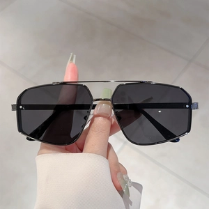 Irregular double bridge aviator sunglasses with dark gunmetal frames and black lenses