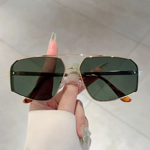 Minimalist double-bridge irregular sunglasses with gold metal frame and dark green lenses