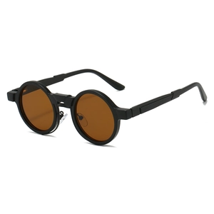 Detailed side view of vintage round steampunk sunglasses with thick black frames