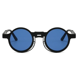 Detail view of round steampunk sunglasses with matte black frames and blue lenses