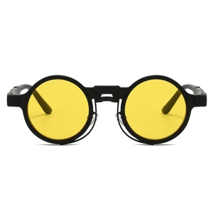 Detailed front view of retro steampunk sunglasses with round black frames and yellow lenses