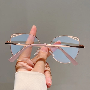 Close-up of rose gold cat-eye hollow frame glasses with anti-blue light lenses