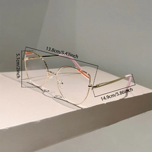 Detailed dimensions of gold cat-eye glasses frame with pink accents and metal temple