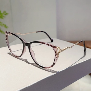Detailed side view of cat-eye frames with purple leopard pattern and wavy gold temples