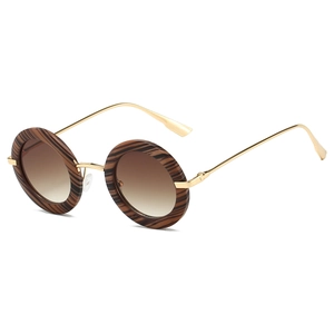Detail of vintage round sunglasses with tortoiseshell frames and gold metal temples