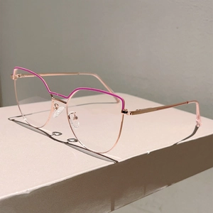 Detail of rose gold cat-eye glasses with pink accents on a geometric pedestal