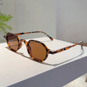 Close-up of retro tortoiseshell round frame sunglasses with brown translucent lenses